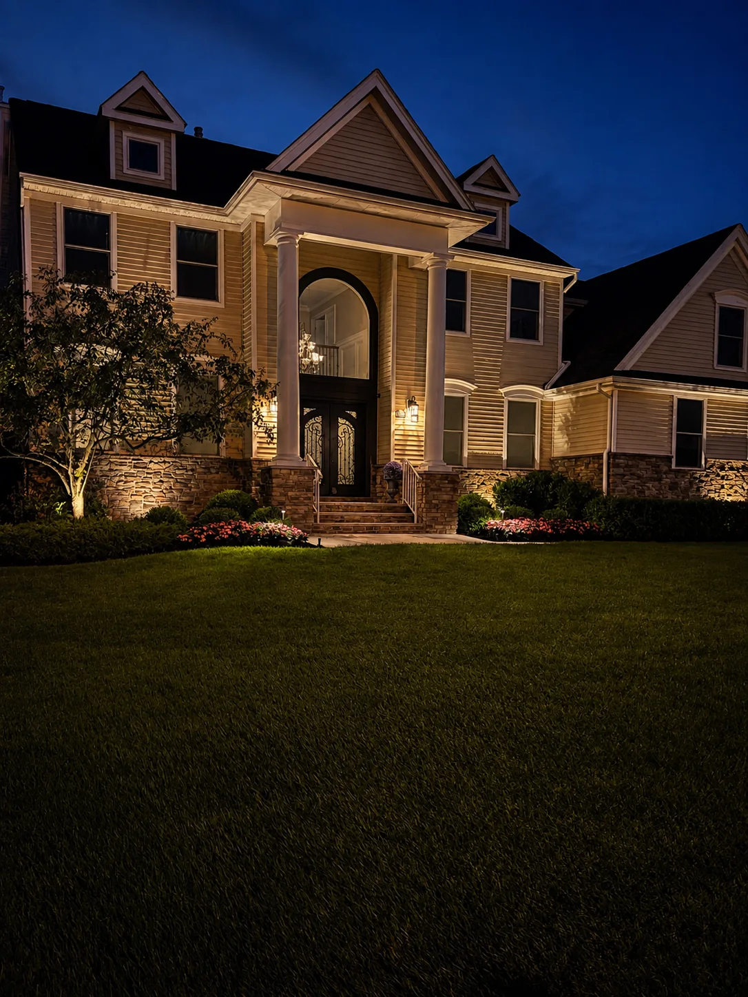 Architectural lighting around a grand residential entry